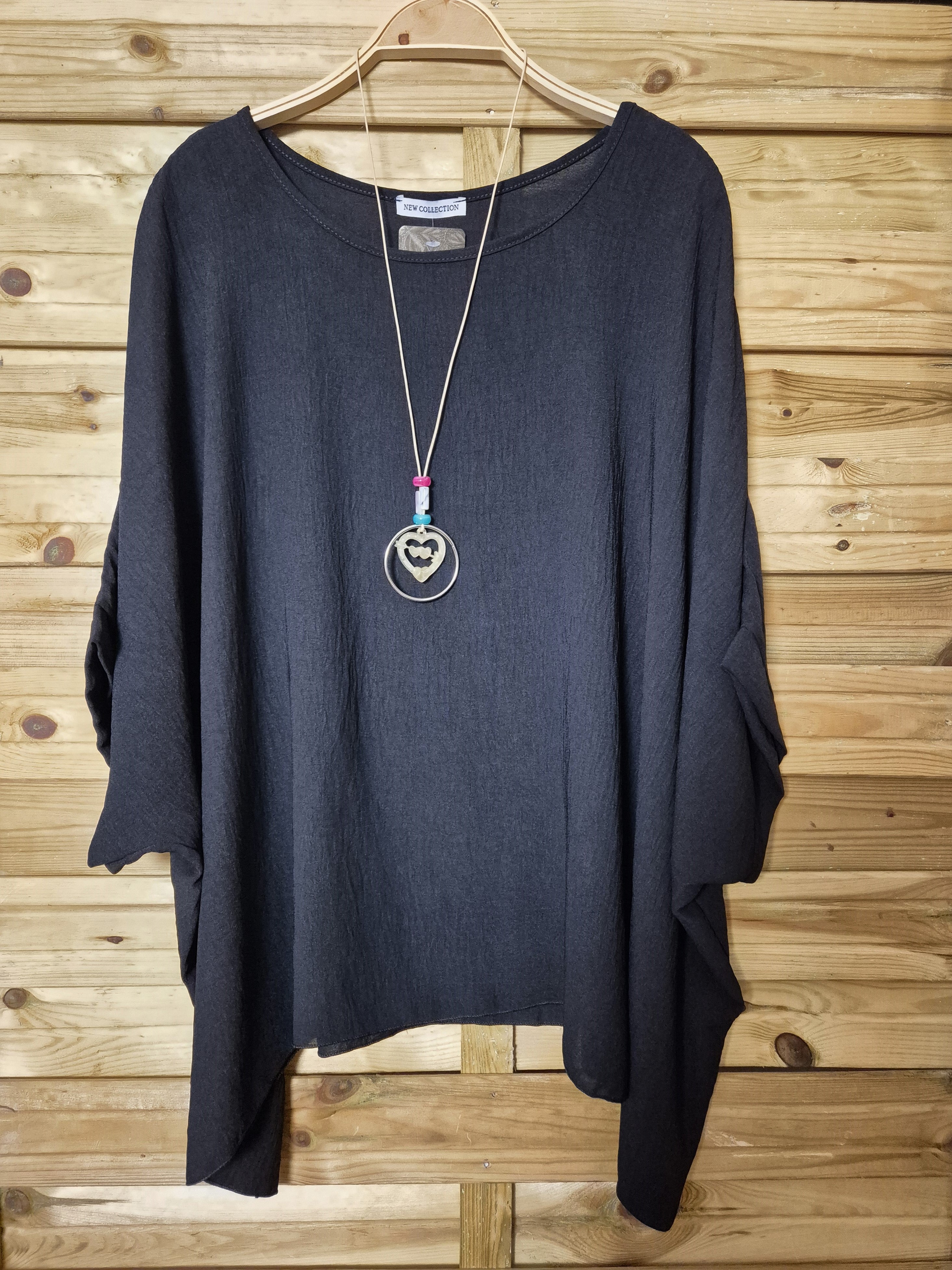 Blusa amplia con colgante incluido · Talla única XL–4XL