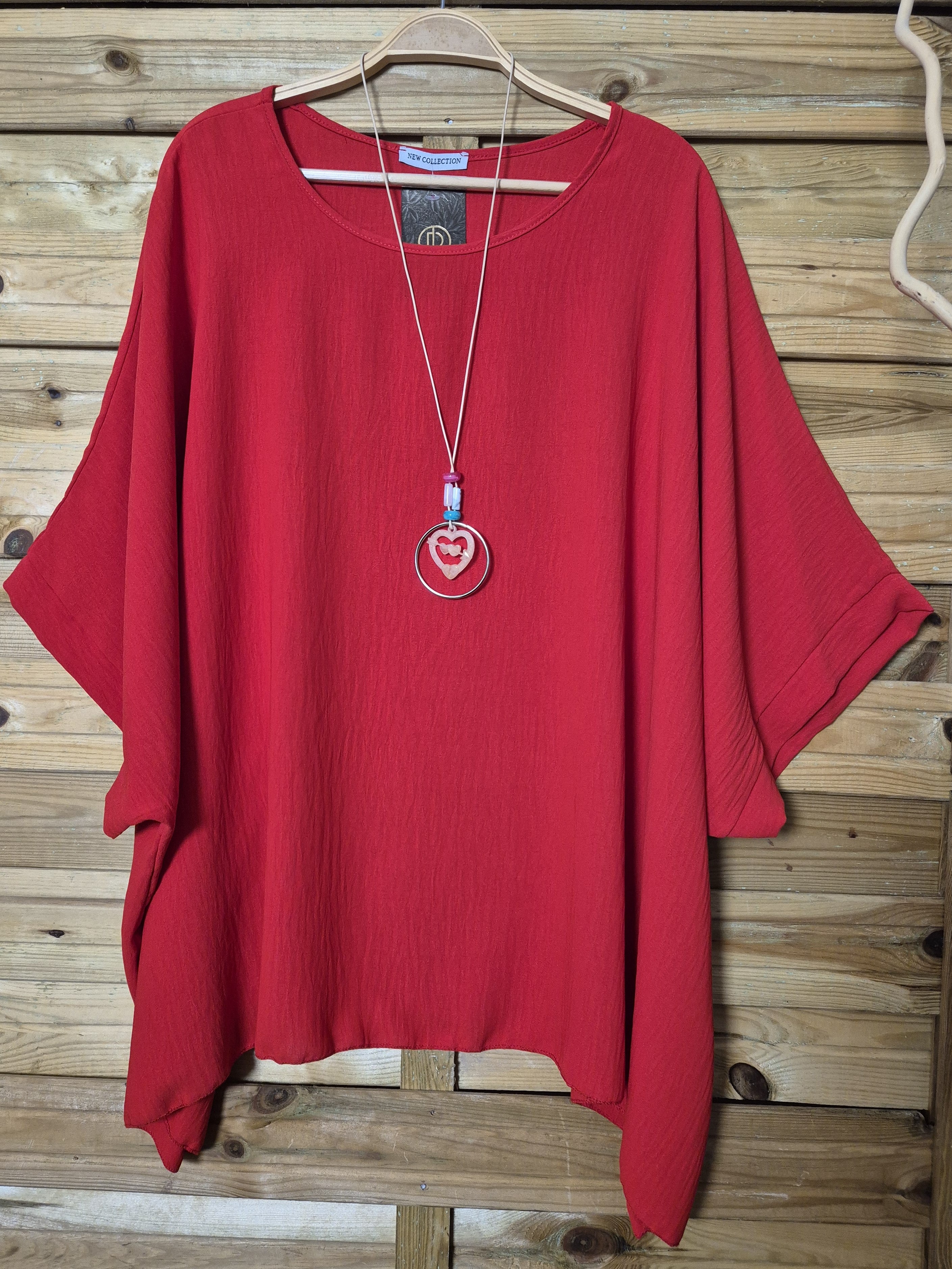 Blusa amplia con colgante incluido · Talla única XL–4XL